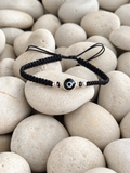 Pulsera tejida de ojo turco negro