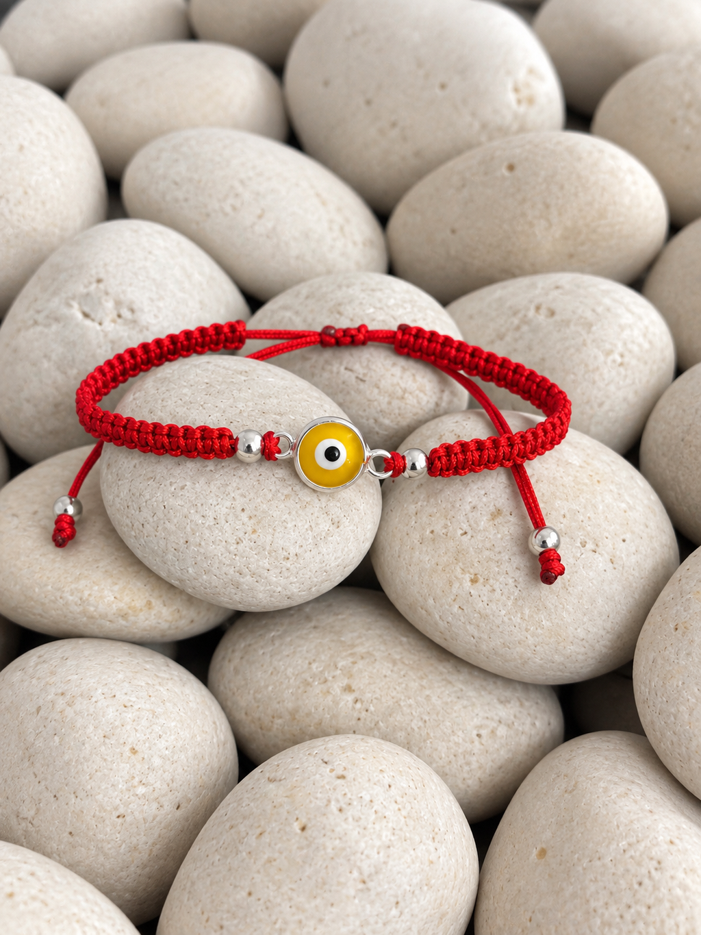 Pulsera tejida de ojo turco amarillo