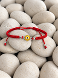 Pulsera tejida de ojo turco amarillo