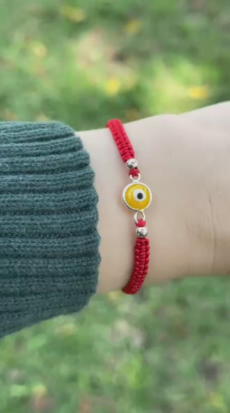 Pulsera tejida de ojo turco amarillo